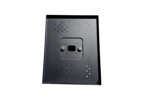 Printer cover back panel in dark metal with dotted holes and central mounting plate